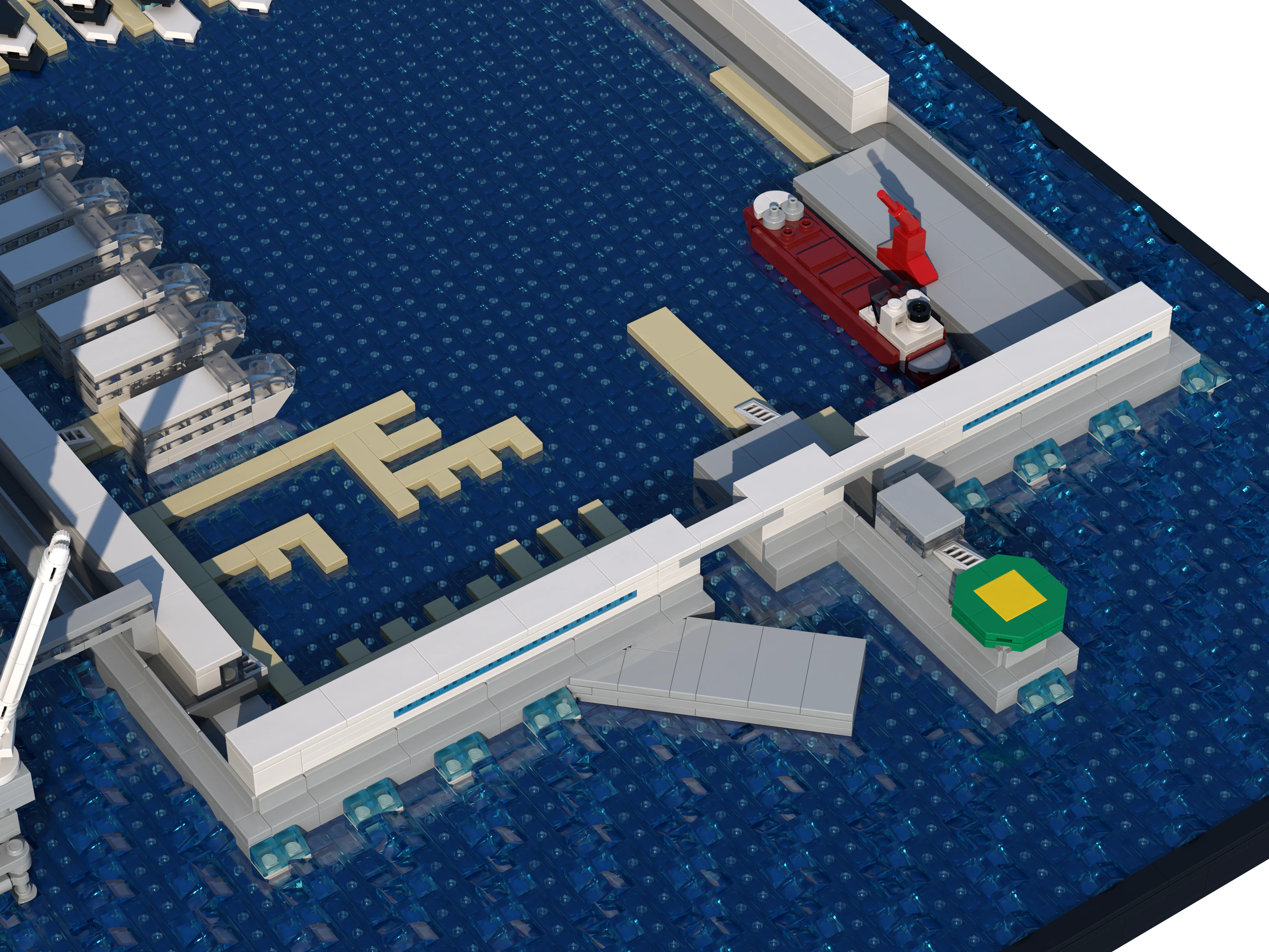 Harbour entrance of the LEGO model of The Rig, with a tanker, a crane and a helideck on the breakwater